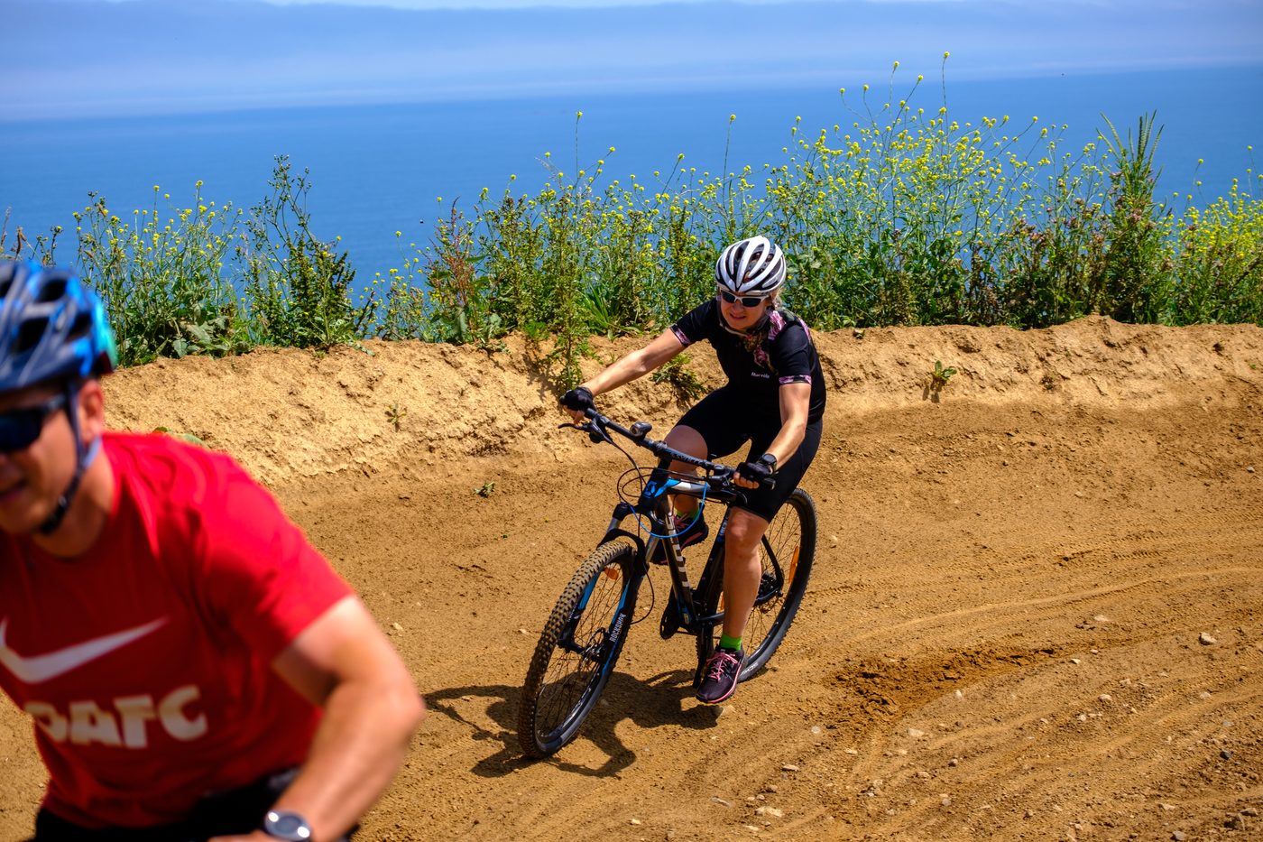 Tess Morris-Paterson mountain biking on a trail